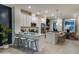 Bright kitchen with white cabinets, stainless steel appliances, breakfast bar, and pendant lighting at 1755 Spreader Ln, Sarasota, FL 34240