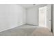 Neutral bedroom featuring gray carpet and open doorway at 18032 Cherished Loop, Bradenton, FL 34211