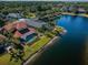 Aerial view of the property showcasing the pool, backyard, and waterfront location at 3033 Stonegate Falls Dr, Land O Lakes, FL 34638