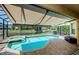 Backyard pool and patio with screen enclosure and water view at 3033 Stonegate Falls Dr, Land O Lakes, FL 34638