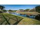 Beautiful waterfront view from the property with lush greenery and peaceful surroundings at 3033 Stonegate Falls Dr, Land O Lakes, FL 34638