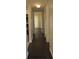 Hallway with wood flooring leading to the kitchen and bedroom at 3102 W Horatio St # 12, Tampa, FL 33609