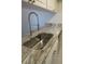 The kitchen sink shows off a stainless steel sink, modern faucet, and countertop at 3102 W Horatio St # 12, Tampa, FL 33609
