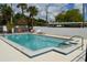Community pool with lounge chairs and a well-maintained deck at 3102 W Horatio St # 12, Tampa, FL 33609