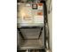 Close-up image of an HVAC unit filter showcasing various warning stickers and diagrams on the machine at 3102 W Horatio St # 21, Tampa, FL 33609