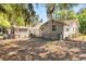 View of house and backyard with shed at 3703 Cooper Rd, Plant City, FL 33565