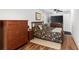 Cozy bedroom features hardwood floors, a ceiling fan, and and dressers at 3703 Cooper Rd, Plant City, FL 33565