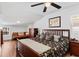 Charming bedroom with hardwood floors and ceiling fan for a cozy living experience at 3703 Cooper Rd, Plant City, FL 33565