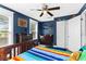 Cozy bedroom featuring hardwood floors, lots of natural light, and a spacious closet at 3703 Cooper Rd, Plant City, FL 33565