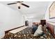 Charming bedroom with hardwood floors and ceiling fan for a cozy living experience at 3703 Cooper Rd, Plant City, FL 33565
