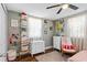 Comfortable bedroom with hardwood floors, natural light and ceiling fan at 3703 Cooper Rd, Plant City, FL 33565