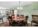 Open concept dining room right off the kitchen, features a round dining table at 3703 Cooper Rd, Plant City, FL 33565