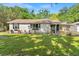 Charming single-story home features a well-maintained lawn and classic design at 3703 Cooper Rd, Plant City, FL 33565