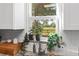 Sunlit kitchen showcasing a garden view from the window over the stainless steel sink at 3703 Cooper Rd, Plant City, FL 33565
