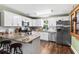 Lovely kitchen with granite countertops, stainless appliances, and white cabinets at 3703 Cooper Rd, Plant City, FL 33565