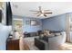 Spacious living area with a modern sofa and a large window bringing in natural light at 3703 Cooper Rd, Plant City, FL 33565