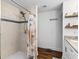 Bathroom showcasing a tiled walk-in shower with a chrome showerhead, and tiled wall niche at 3703 Cooper Rd, Plant City, FL 33565