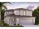 Charming two-story home with a two-car garage and well-manicured lawn in a residential neighborhood at 16854 Fiesta Dr, Port Charlotte, FL 33953