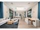Gather in the spacious lounge with plush seating, modern decor, and lots of natural light at 17212 Savory Mist Cir, Lakewood Ranch, FL 34211