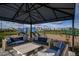 Outdoor lounge area with comfortable seating, playground, and open green space for community enjoyment at 17216 Savory Mist Cir, Bradenton, FL 34211