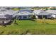 The backyard has a green lawn, covered patio and great neighborhood views at 17245 Savory Mist Cir, Bradenton, FL 34211