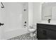 Bathroom with black accents, tiled shower and floor at 17245 Savory Mist Cir, Bradenton, FL 34211