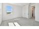 Bright bedroom featuring neutral carpet, light walls, window, and white trim at 17245 Savory Mist Cir, Bradenton, FL 34211