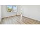 Bright bedroom with light colored floors and a view at 17245 Savory Mist Cir, Bradenton, FL 34211