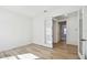 This bright room has wood floors, white walls and trim, and a glass door providing a view into the hallway at 17245 Savory Mist Cir, Bradenton, FL 34211