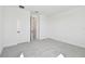 Bright bedroom with carpet floors and two doors at 17245 Savory Mist Cir, Bradenton, FL 34211