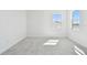 Bright bedroom featuring neutral carpet, light walls, and a view at 17245 Savory Mist Cir, Bradenton, FL 34211