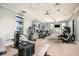 Fitness center with modern exercise equipment, ceiling fans, and natural light at 17245 Savory Mist Cir, Bradenton, FL 34211