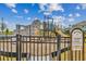 Community playground featuring climbing wall, slides, swings and lush landscaping at 1933 Transom Ln, Sarasota, FL 34240