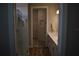 Bathroom featuring double sinks, walk-in shower and walk-in closet at 2735 Lavandula Ct, North Port, FL 34289