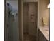 Bathroom featuring double sinks, walk-in shower and walk-in closet at 2735 Lavandula Ct, North Port, FL 34289