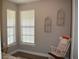 Inviting bedroom featuring natural light, hard surface floors and a rocking chair at 2735 Lavandula Ct, North Port, FL 34289
