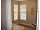 Inviting bedroom featuring natural light, hard surface floors and a rocking chair at 2735 Lavandula Ct, North Port, FL 34289