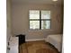 Bright bedroom with large window, ceiling fan, neutral color scheme, and light-colored carpet at 2735 Lavandula Ct, North Port, FL 34289