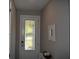 A welcoming foyer features a decorative front door with glass panels and neutral wall paint at 2735 Lavandula Ct, North Port, FL 34289