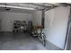 Spacious garage featuring white walls, concrete floor, water heater, utility sink and storage shelves at 2735 Lavandula Ct, North Port, FL 34289