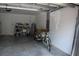 Spacious garage featuring white walls, concrete floor, water heater, utility sink and storage shelves at 2735 Lavandula Ct, North Port, FL 34289