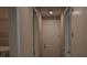 Hallway showing a door and wood-look tile flooring throughout the house at 2735 Lavandula Ct, North Port, FL 34289