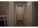 Hallway showing a door and wood-look tile flooring throughout the house at 2735 Lavandula Ct, North Port, FL 34289