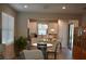 A well-lit modern kitchen featuring stainless steel appliances and a cozy breakfast nook with pendant lighting at 2735 Lavandula Ct, North Port, FL 34289