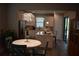 An elegant kitchen with a marble island, stylish lighting fixture, and stainless steel appliances at 2735 Lavandula Ct, North Port, FL 34289