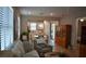 An open floor plan reveals a sunlit living room connected to a modern kitchen, perfect for entertaining at 2735 Lavandula Ct, North Port, FL 34289