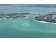 Stunning aerial view of the coastal waterway with sandy beaches and waterfront residences at 3060 Grand Bay Blvd # 174, Longboat Key, FL 34228
