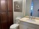 Well-lit bathroom featuring a vanity with light marble countertops, storage cabinets and soft towels at 3060 Grand Bay Blvd # 174, Longboat Key, FL 34228