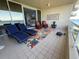 Spacious patio with cozy lounge chairs and stunning waterfront scenery at 3060 Grand Bay Blvd # 174, Longboat Key, FL 34228