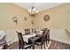 Cozy dining area with a stylish chandelier, seating for six, and decorative wall accents at 4604 W Fig St # 1, Tampa, FL 33609